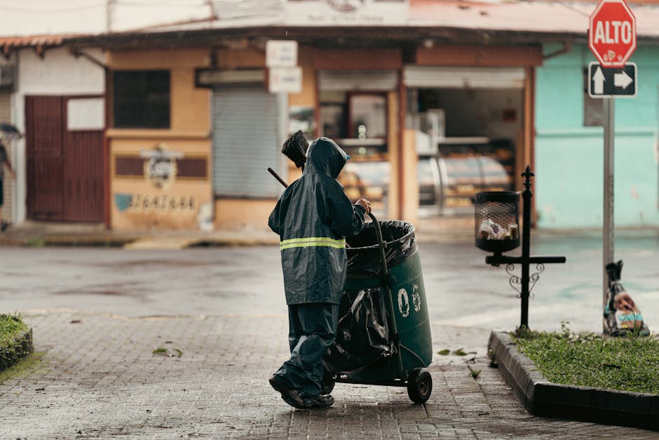 Friendly cleaning service professional preparing equipment