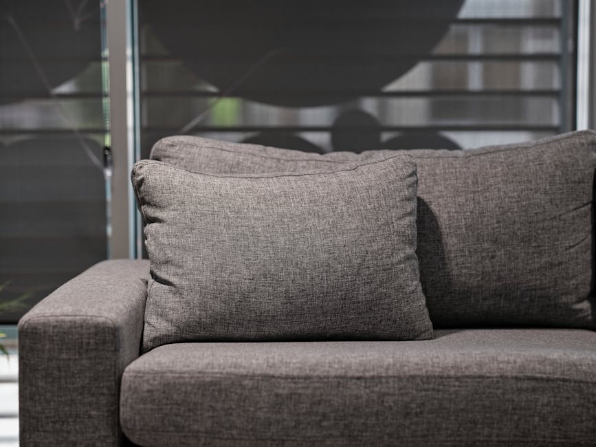 Detailed upholstery cleaning of a fabric sofa